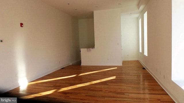 empty room featuring dark hardwood / wood-style flooring