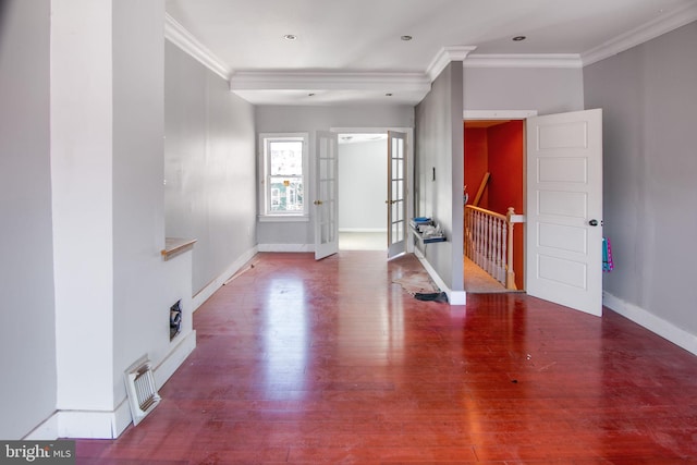 foyer entrance featuring dark wood-type flooring and ornamental molding