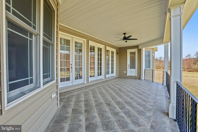 exterior space featuring ceiling fan