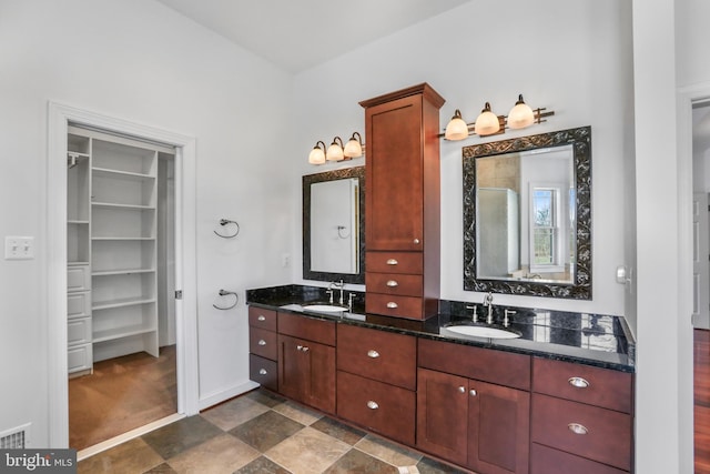 bathroom with tile floors and double sink vanity