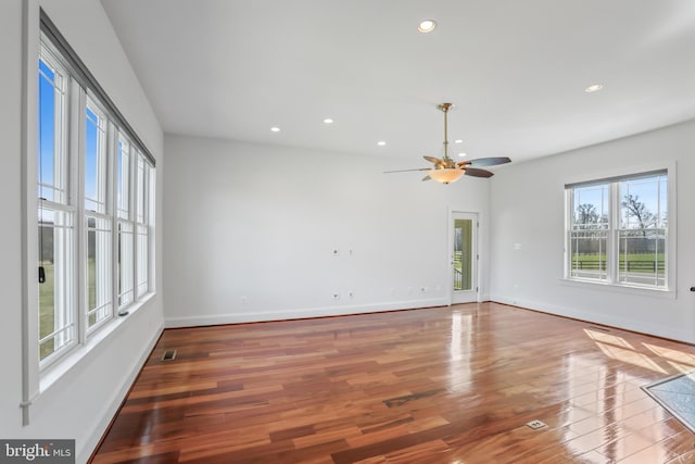 empty room featuring light hardwood / wood-style flooring and ceiling fan