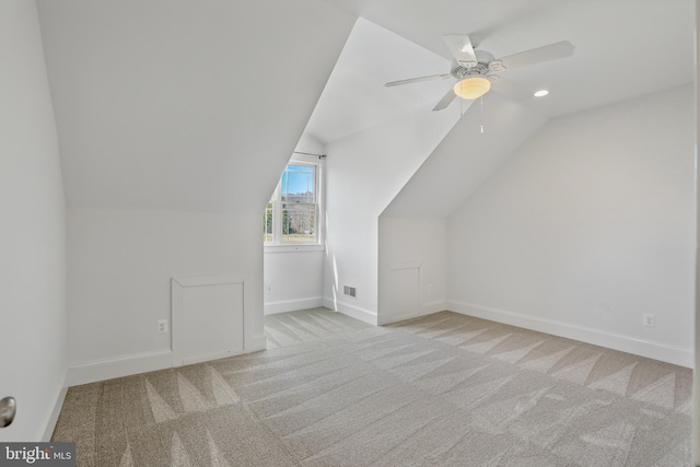 bonus room featuring ceiling fan, lofted ceiling, and light colored carpet