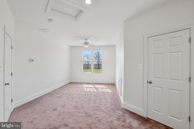 interior space featuring ceiling fan and dark carpet