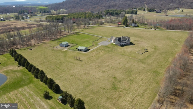 birds eye view of property with a rural view