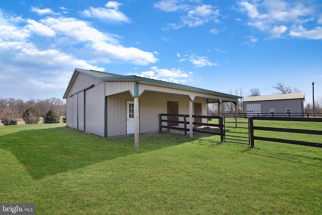 back of property featuring a yard