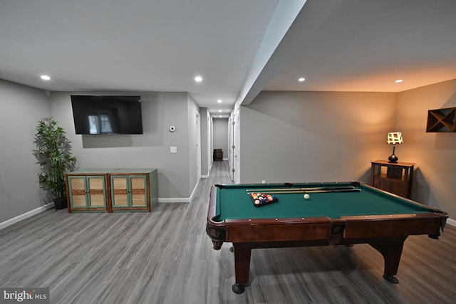 recreation room with hardwood / wood-style floors and pool table