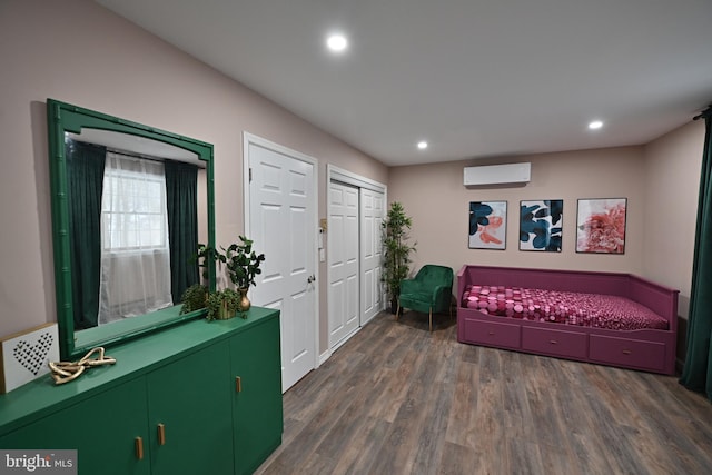 foyer entrance with dark wood-type flooring and an AC wall unit