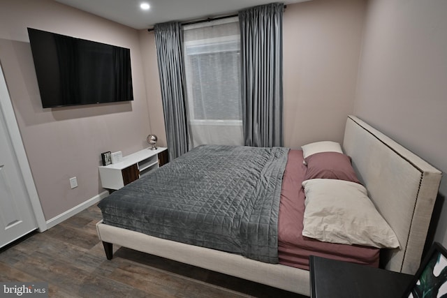 bedroom featuring dark hardwood / wood-style floors