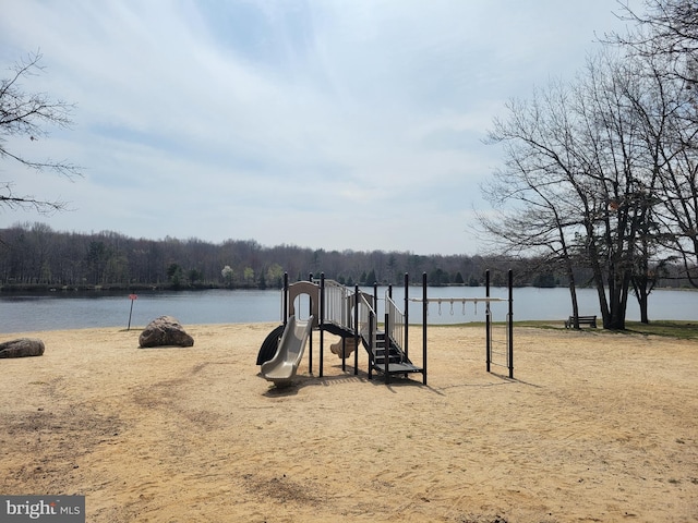 view of playground with a water view