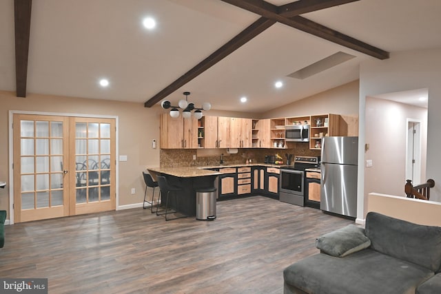 kitchen featuring stainless steel appliances, dark hardwood / wood-style floors, kitchen peninsula, a breakfast bar, and vaulted ceiling with beams