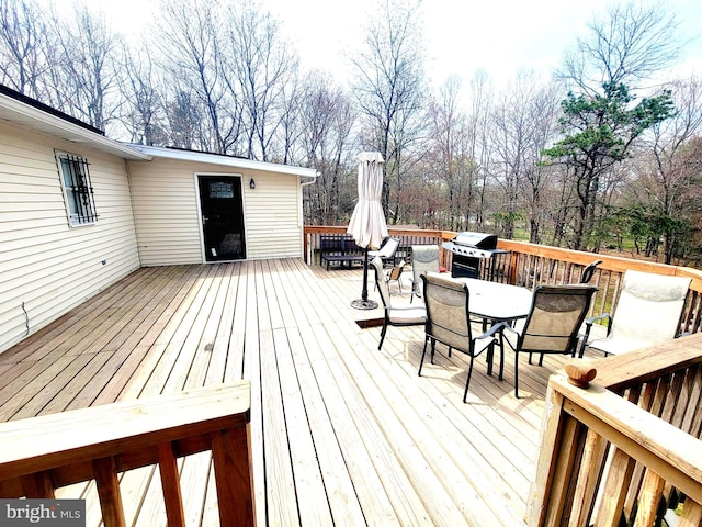 wooden terrace featuring grilling area