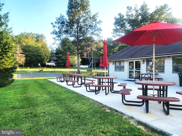 surrounding community featuring a patio area and a lawn