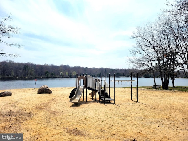 view of jungle gym featuring a water view