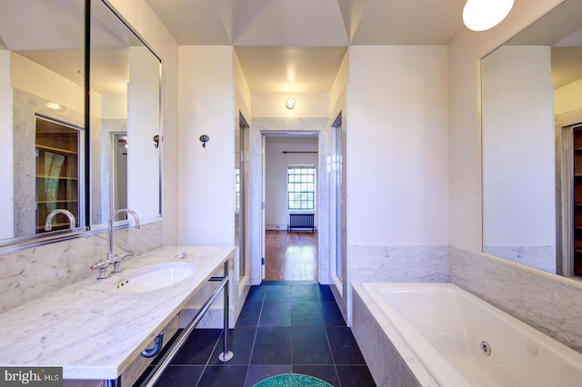 bathroom with vanity, tile floors, and a relaxing tiled bath