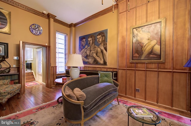 bedroom with crown molding and hardwood / wood-style flooring