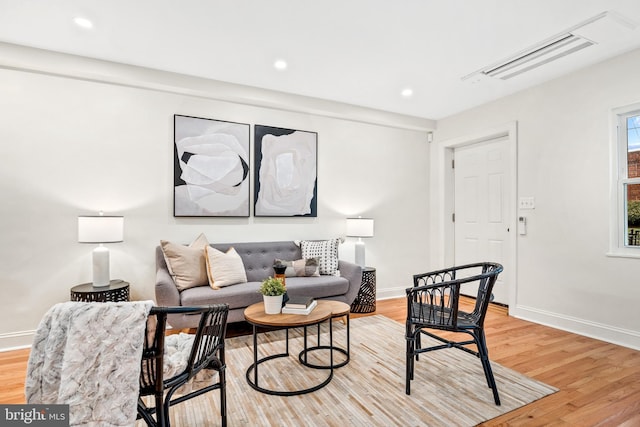 living room with light hardwood / wood-style floors