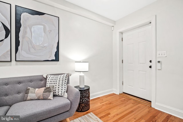 living area with hardwood / wood-style floors