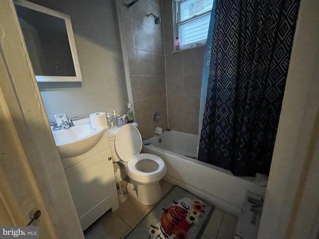 full bathroom featuring tile floors, toilet, vanity, and shower / tub combo with curtain