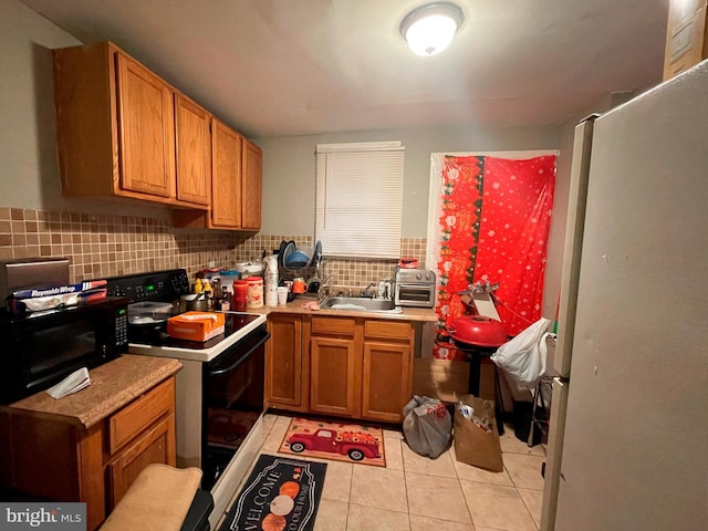 kitchen with sink, backsplash, white appliances, and light tile floors