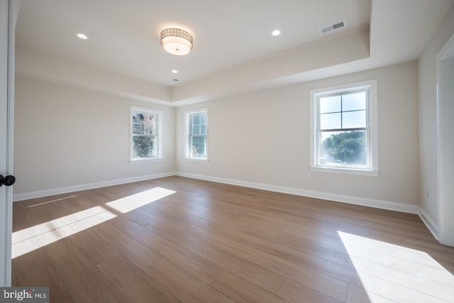 unfurnished room with light hardwood / wood-style floors