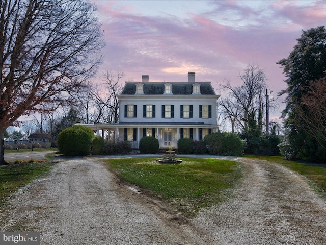 view of front of property with a lawn