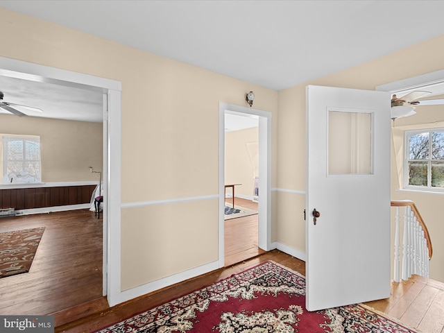 corridor with light hardwood / wood-style flooring