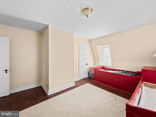 bedroom featuring dark wood-type flooring