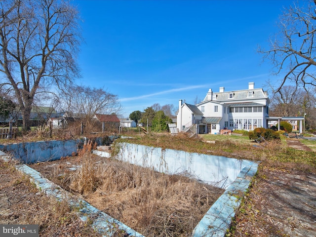 back of house with a water view