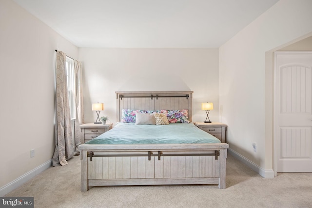 bedroom featuring light carpet