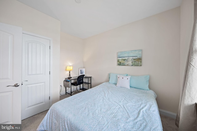 carpeted bedroom with a closet