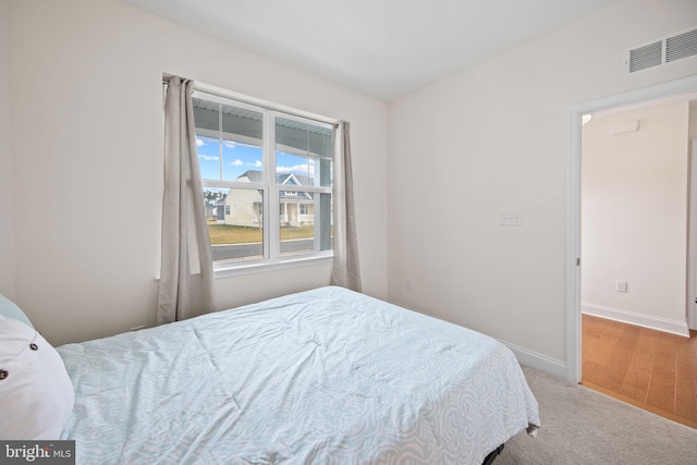 bedroom with light carpet