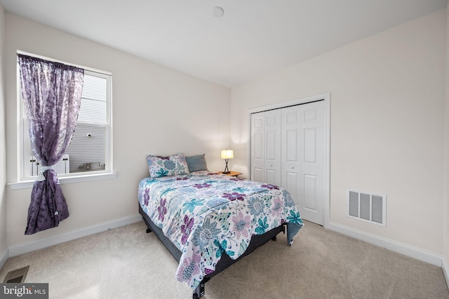 carpeted bedroom with a closet