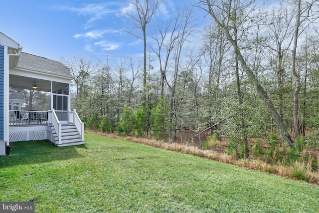 view of yard with ceiling fan