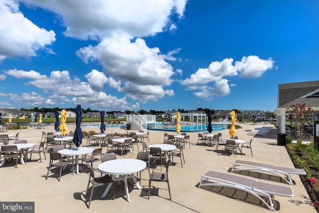 view of terrace featuring a community pool