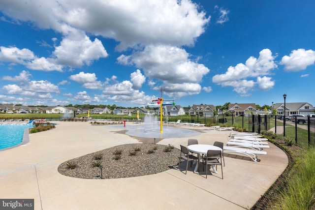 view of terrace with a community pool