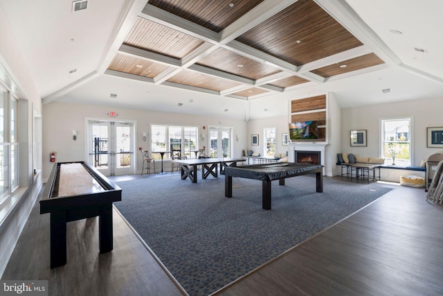 living room featuring dark hardwood / wood-style flooring, french doors, a healthy amount of sunlight, and coffered ceiling