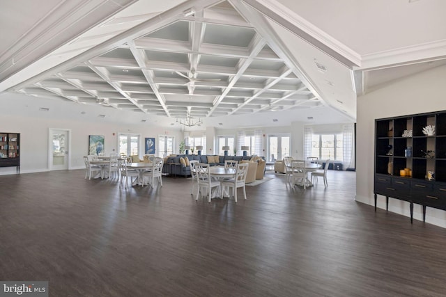 exercise room featuring a chandelier and dark wood-type flooring