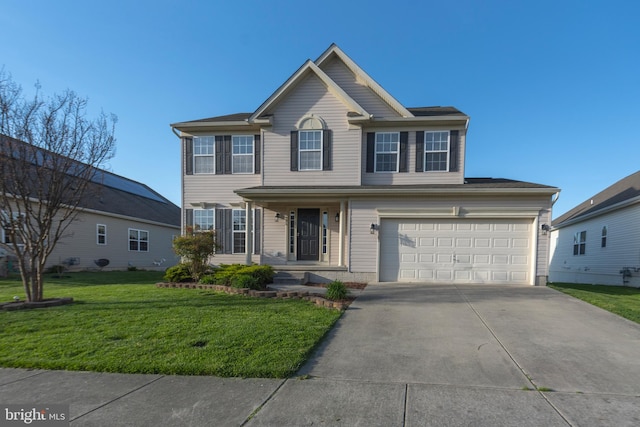 view of front of property featuring a garage and a front yard