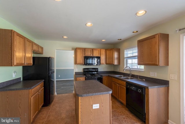 kitchen with a kitchen island, tile flooring, sink, and black appliances