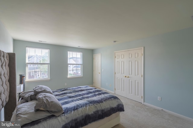 bedroom with light carpet