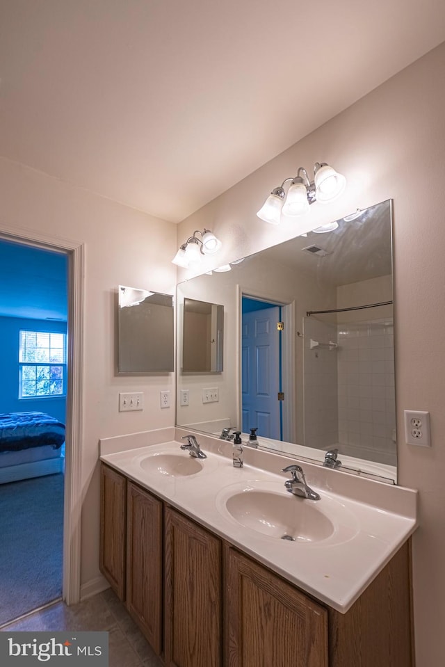 bathroom with tile flooring and dual bowl vanity