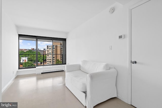 sitting room featuring light hardwood / wood-style floors and radiator