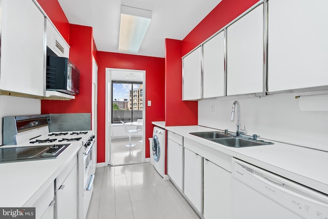 kitchen with washer / clothes dryer, white cabinets, white appliances, and sink