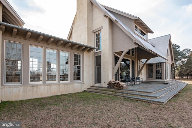 back of house featuring a patio