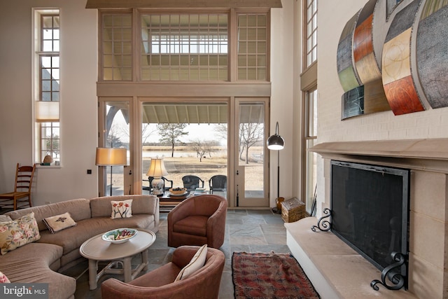 living room featuring plenty of natural light and a high ceiling