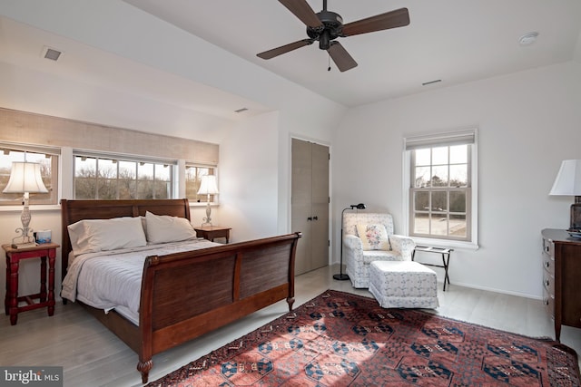 bedroom featuring light hardwood / wood-style floors and ceiling fan