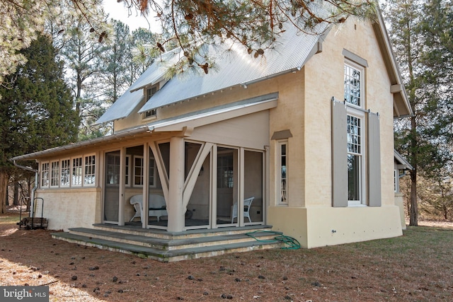 exterior space with a sunroom