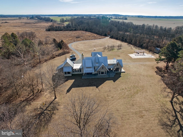 birds eye view of property featuring a rural view