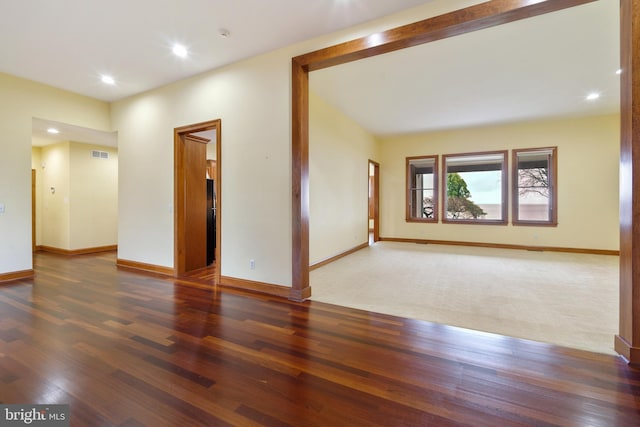 empty room with dark wood-type flooring
