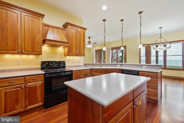 kitchen featuring ceiling fan, custom range hood, black appliances, and dark hardwood / wood-style flooring